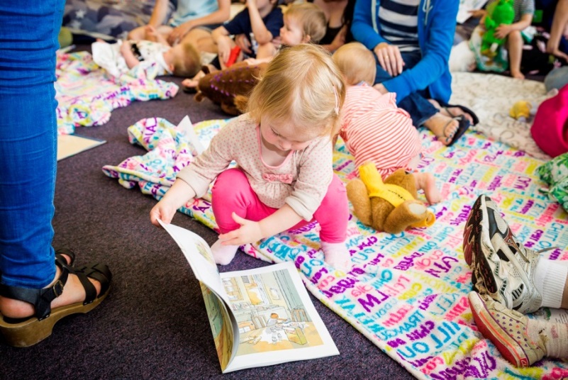 A child at a ‘Tiny Reads’ shared reading group, hosted by The Reader Organisation at Calderstones Park
