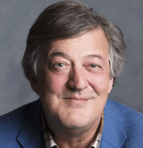Headshot of Stephen Fry smiling directly at camera